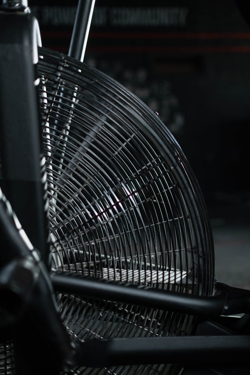 Active person doing cardio exercises in a dark gym environment